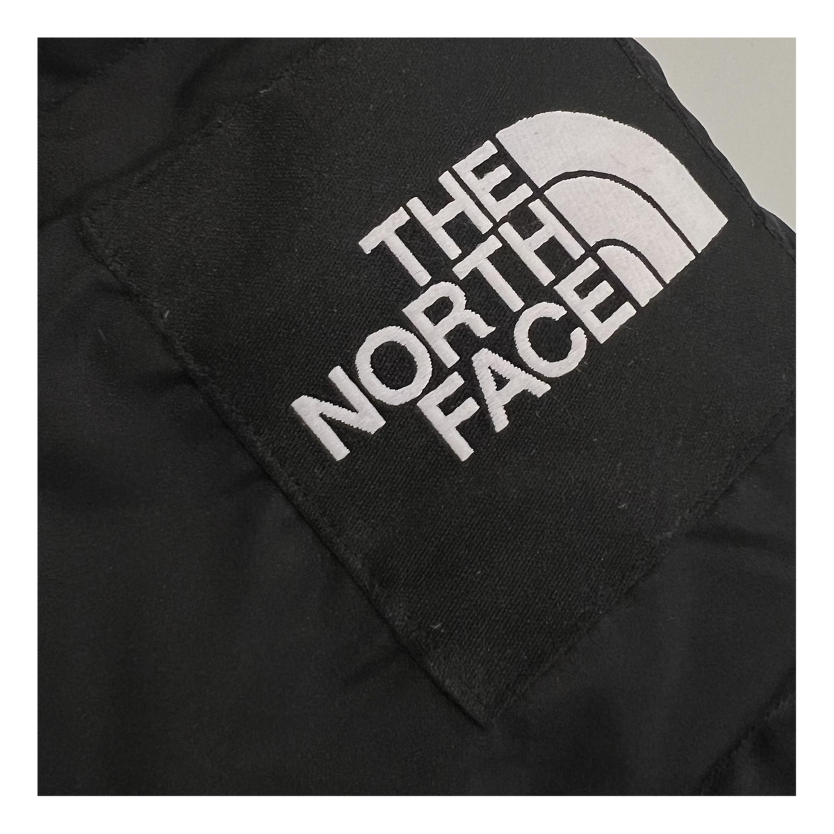 The North Face Hooded Long Puffer Coat in Black