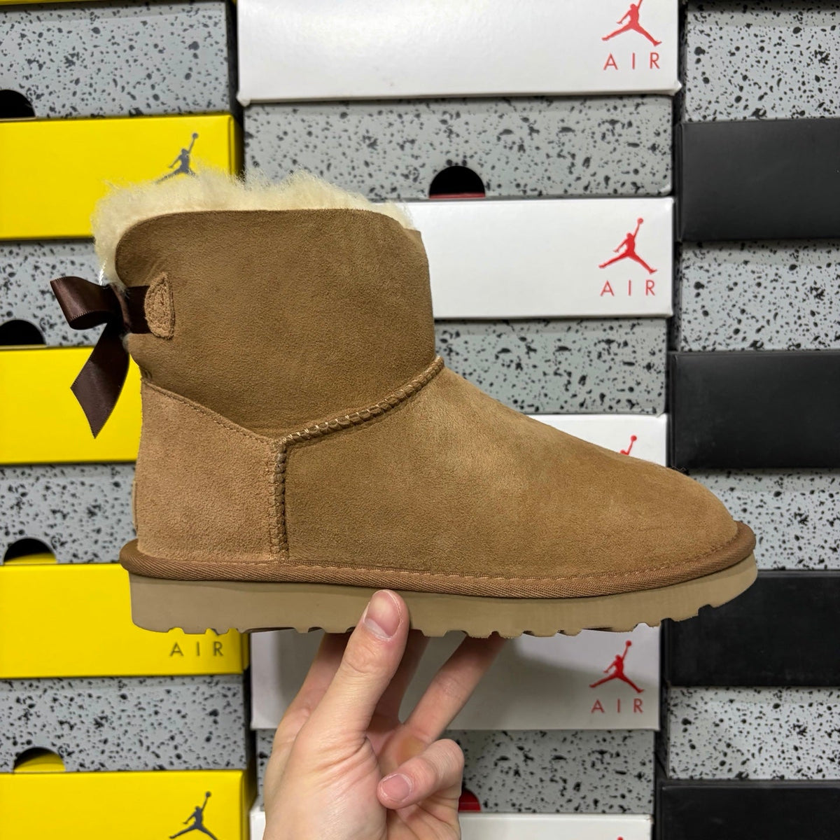 UGG Mini Bailey Bow Ankle Boot – Suede Boot with Cream Shearling Lining, Dark Chocolate Satin Bow & Tan Sugar Sole in Chestnut