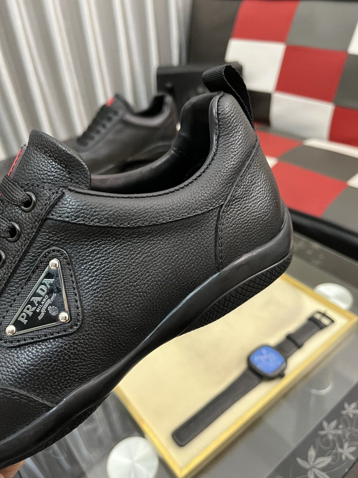Prada Black Lace-Up Sneakers with Red Tab